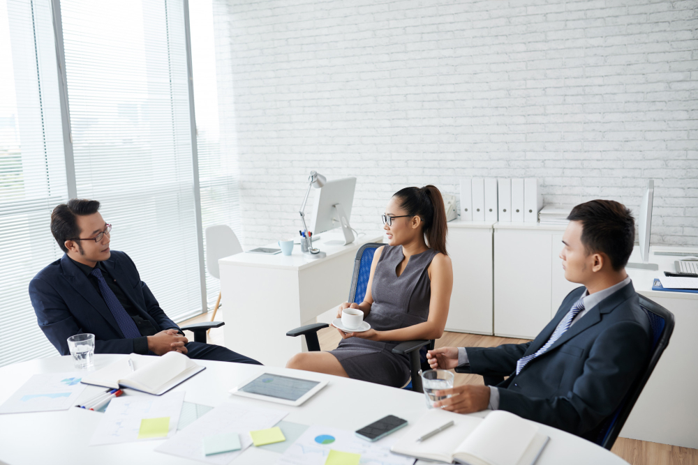 group young business people working sitting office desk